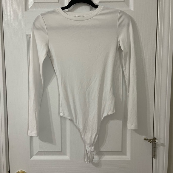 Elodie Tops Basic White Long Sleeve Bodysuit With Thong Bottom — free download